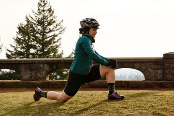 a female cyclist stretching