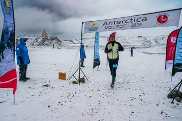 a person standing on a snow covered mountain