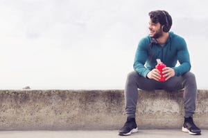 muscular man jogging in foggy morning