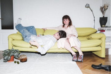 a man and woman sitting on a couch