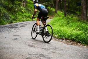 a man riding a bicycle on a road