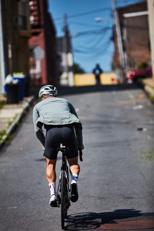 a person riding a bicycle on a street