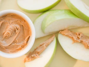 peanut butter on sliced apple, cycling snacks
