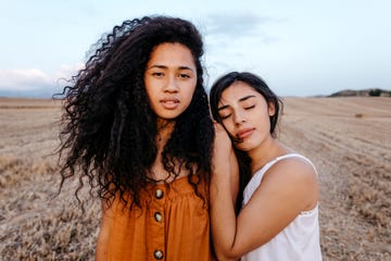 a couple of women posing for the camera