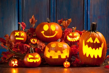 a group of jack o lanterns lit up for the holiday