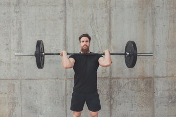 push press exercise performed by a professional gym instructor