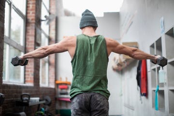 rear view of muscular man exercising