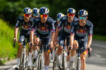 a group of men riding bicycles