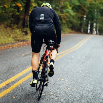 a man riding a bicycle on a road