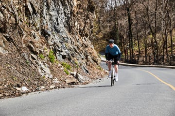 person riding a bike uphill