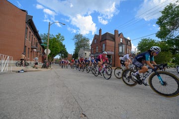 a group of people riding bikes on a street