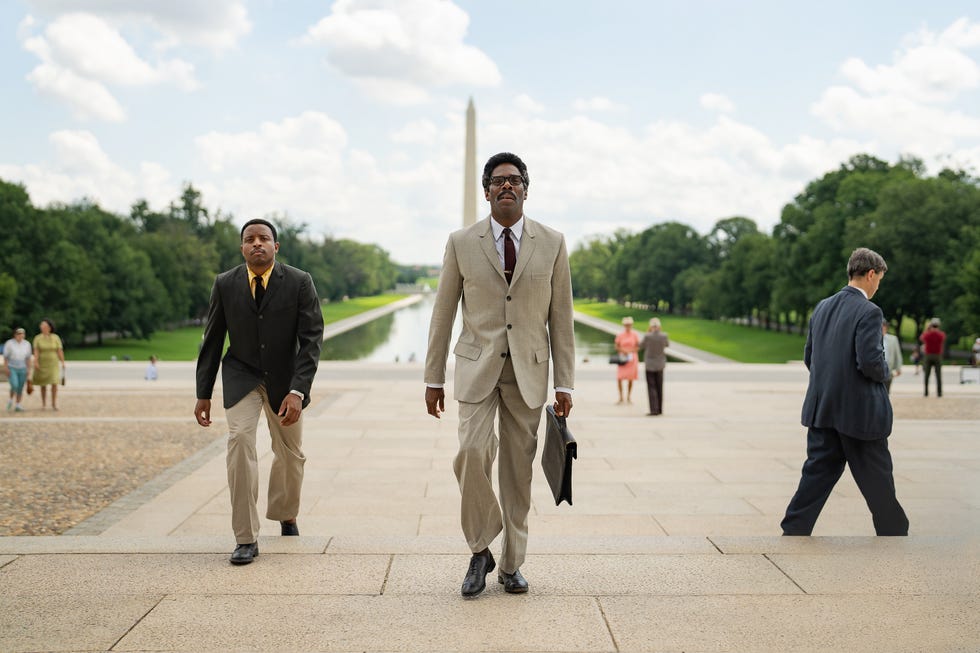 colman domingo carrying a briefcase and walking in washington dc in a scene from the movie rustin