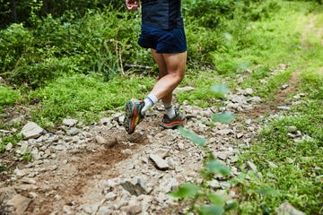a person running on a trail