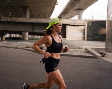 runner on the street with a backwards hat