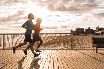 runners on a boardwalk