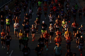 a beam of light hits a group of runners in the 2022 chicago marathon