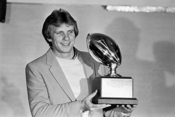 joe montana holds most valuable player trophy