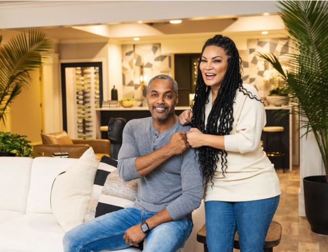 married to real estate egypt sherrod and mike jackson smiling, bumping fists