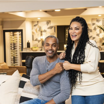 married to real estate egypt sherrod and mike jackson smiling, bumping fists