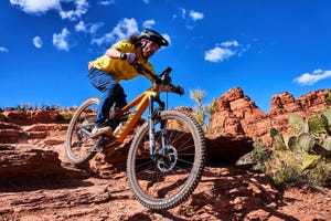 a man riding a bike on a trail