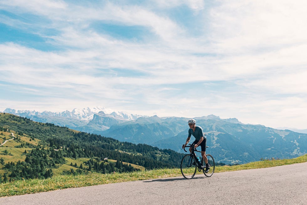 senior cyclist on the top of the col de joux plane