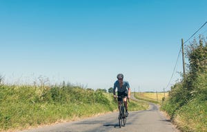 senior cyclist pushing hard