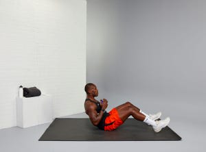 yusuf jeffers trainer performing a situp, crunches vs situps