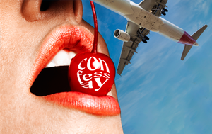 a red cherry in a person's mouth with a plane in the background