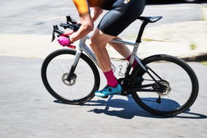 a person sprinting on a bicycle