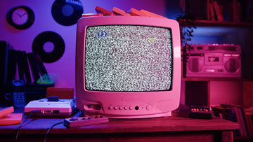 a pink computer on a desk