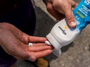 gabe ortiz putting on sunscreen before a ride