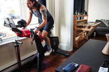 a person riding out on a stationary bike