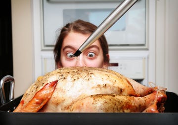 meme worthy photo young girl wide eyed watching thanksgiving turkey being basted