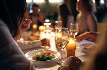 woman eating at a dinner party