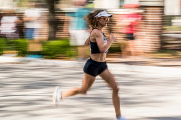 a woman running on a street