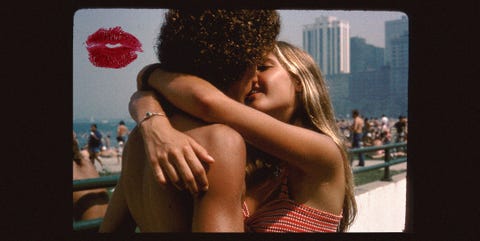 a woman kissing a man on the cheek