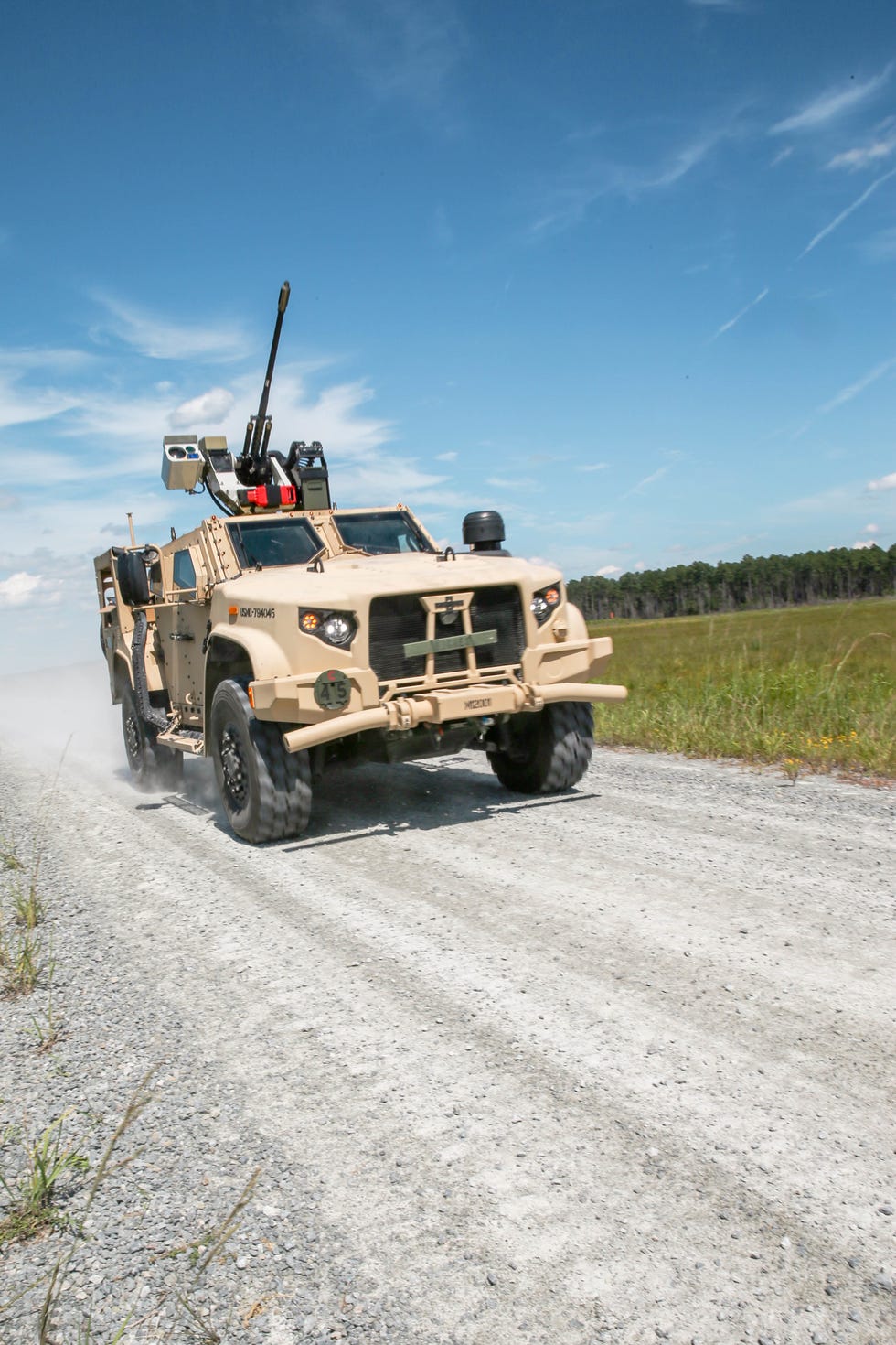 a us marine corps joint light tactical vehicle with 2d assault amphibian battalion, 2d marine division mardiv, repositions during a demonstration at camp lejeune, nc, sept 10, 2021 marines from 2d mardiv partnered with the office of naval research onr to demonstrate a remote live fire using a 30mm system attached to a joint light tactical vehicle onr works with the marine corps and industry partners to research and evaluate capabilities that may ultimately support the needs of the marine corps us marine corps photo by lance cpl reine whitaker