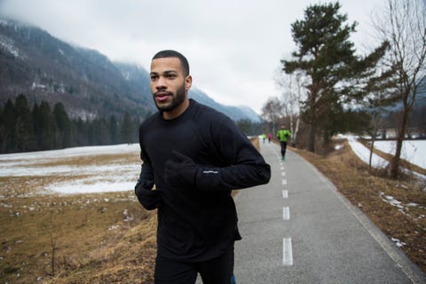 young man running on road