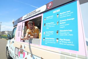 An ice cream van covered in images of sewage