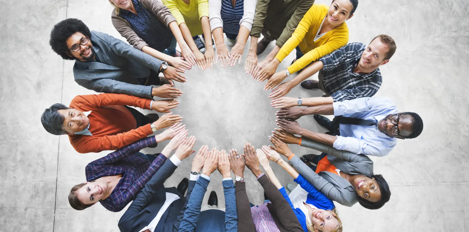 Group of people standing in a circle