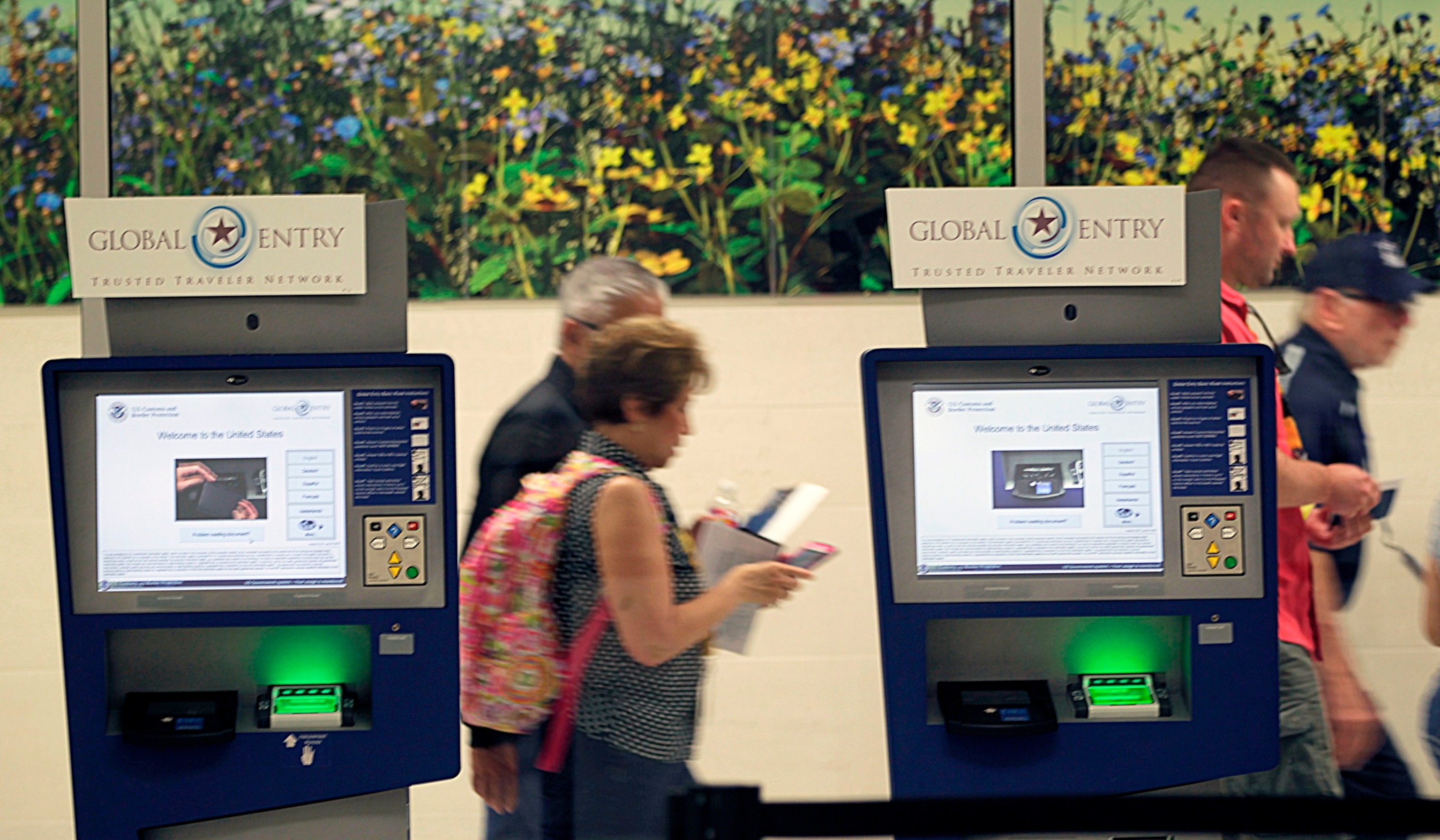 PHOTO: In this Sept. 19, 2015 file photo, volunteers walk past Global Entry Trusted Traveler Network terminals during testing of processes  at Hobby Airport's international concourse in Houston.