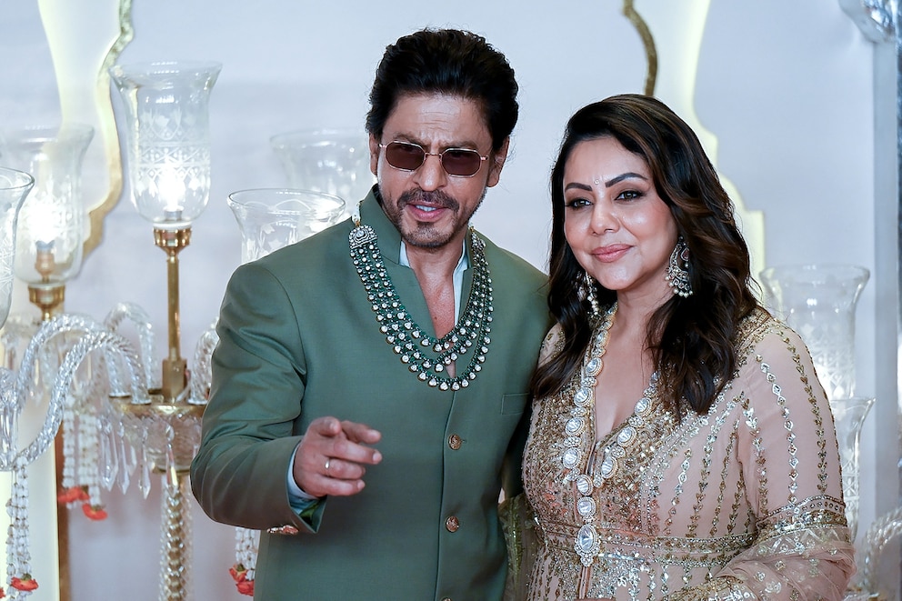 PHOTO: Bollywood actor Shah Rukh Khan (L) with his wife Gauri Khan attend the wedding ceremony of billionaire tycoon and Chairman of Reliance Industries Mukesh Ambani's son Anant Ambani and Radhika Merchant, in Mumbai, on July 12, 2024. 