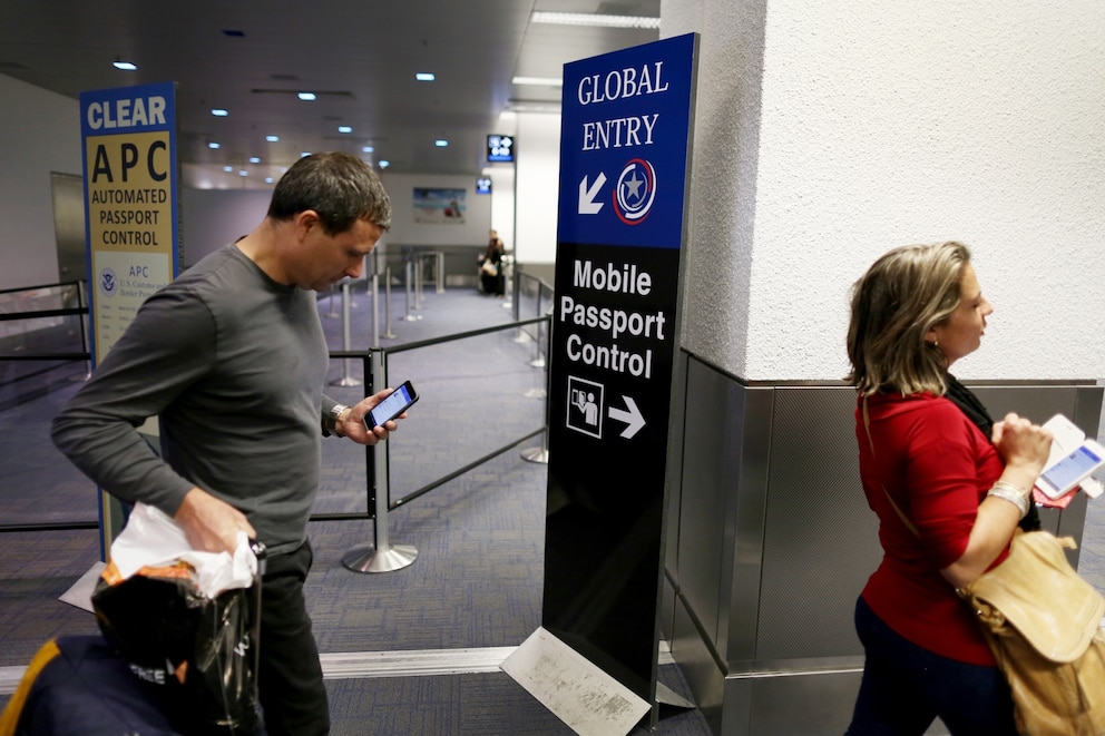 PHOTO: In this March 4, 2015 file photo a sign points passengers  to the mobile passport control window set up for international travelers arriving at Miami International Airport on March in Miami.