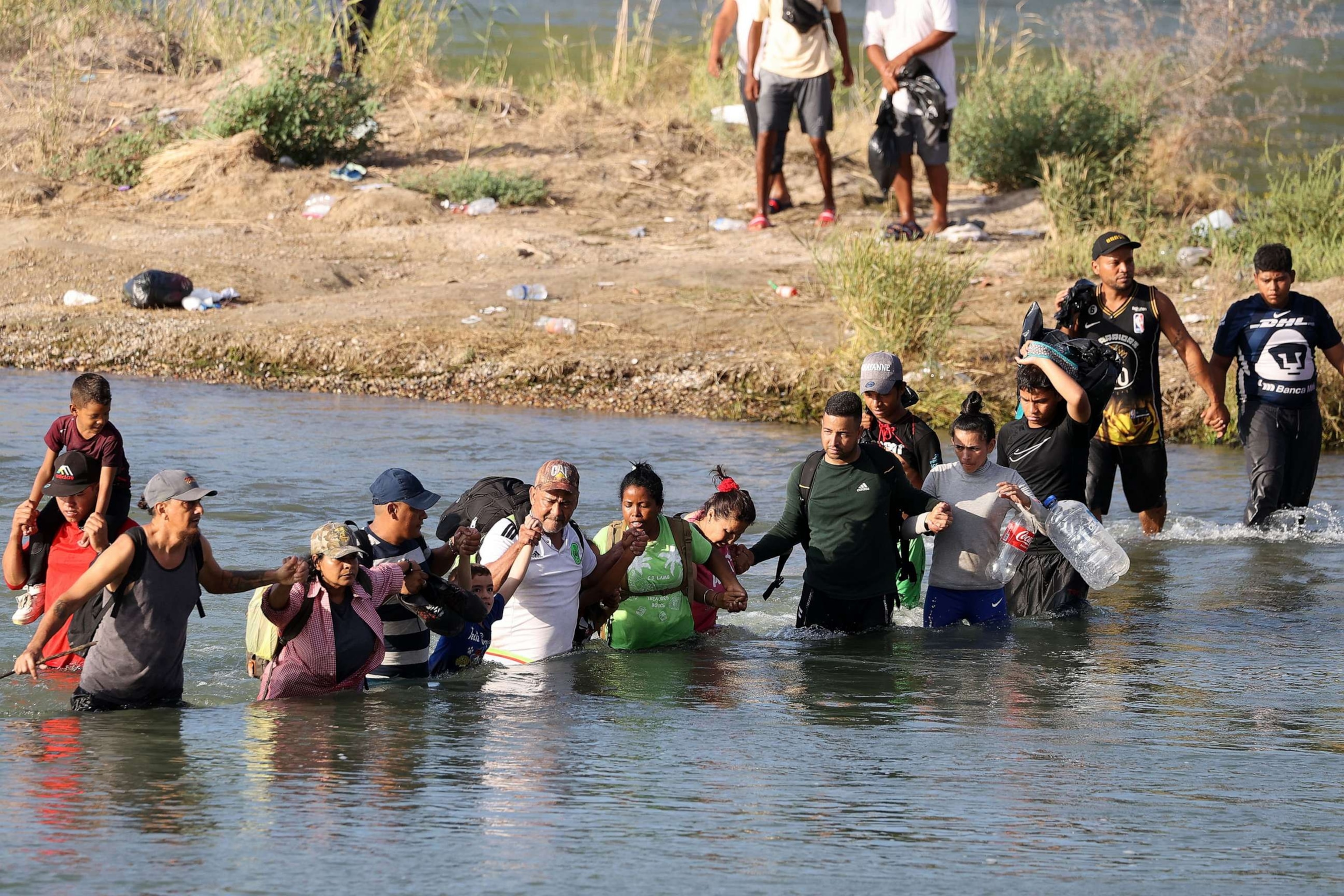 PHOTO: Migrants cross the Rio Grande in Eagle Pass, Texas, on Sept. 22, 2023.