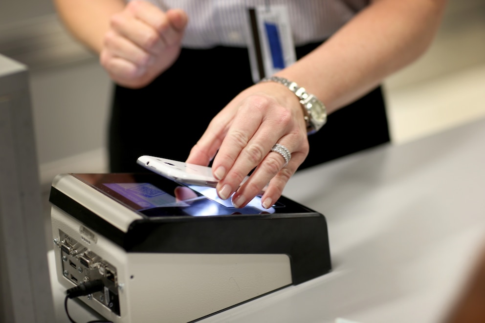 PHOTO: In this  March 4, 2015 file photo CBP Demonstrates New App as she uses the new mobile app for expedited passport and customer screening being unveiled for international travelers arriving at Miami International Airport.