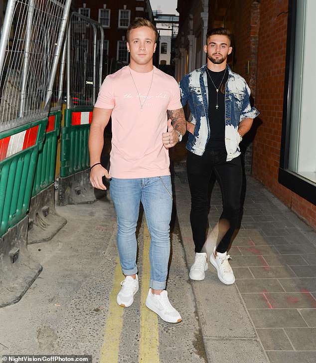Sharp: X Factor star Sam Callahan donned a pastel pink T-shirt with skinny jeans as he joined a pal at the bash
