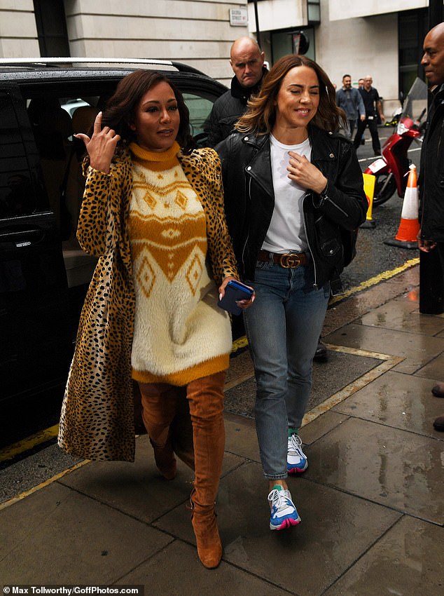 Spot the difference: Staying true to her scary alter-ego, Mel B sported a head-turning leopard print coat over a wool jumped dress