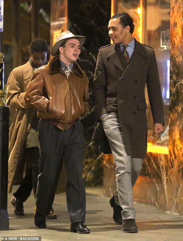 Dapper: Rocco Ritchie looked like a superstar as he donned a 1950s inspired ensemble for a night out with friends in London on Tuesday