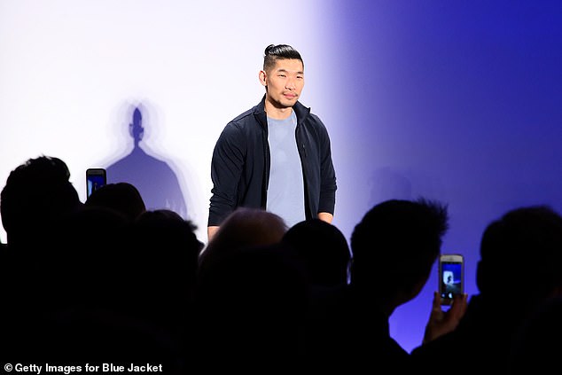 Hunk: Leo Chan went for a simpler jacket for his runway look, flinging a midnight blue bomber over a powder blue tee and arranging his hair in a perfect coiff