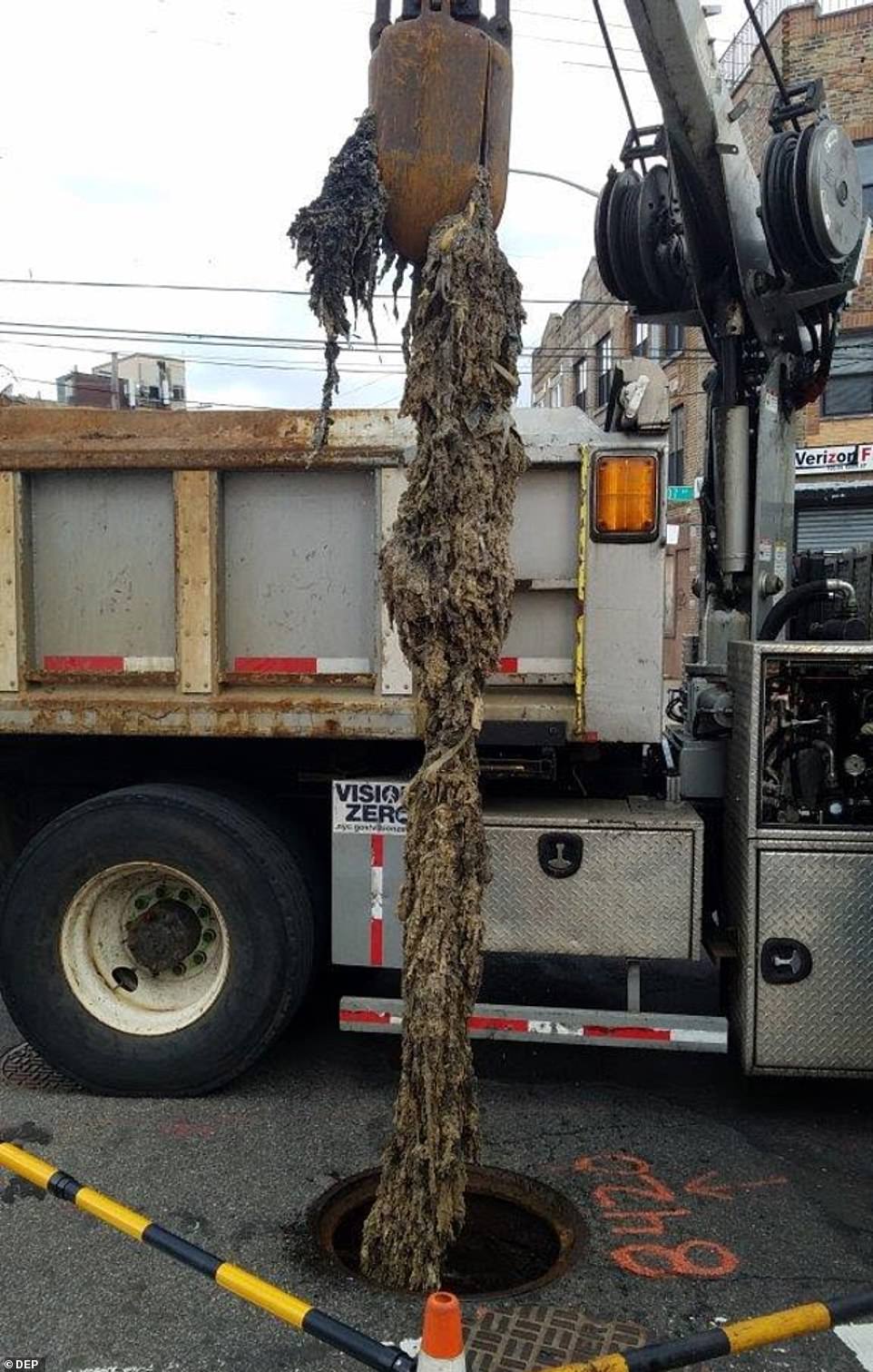 A fatberg is removed from the sewer at 106-55 150th Street near 107th Avenue in South Jamaica, Queens